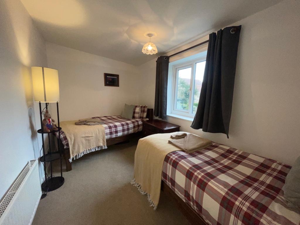 2 Single Beds, full length with no footboards in Second Bedroom