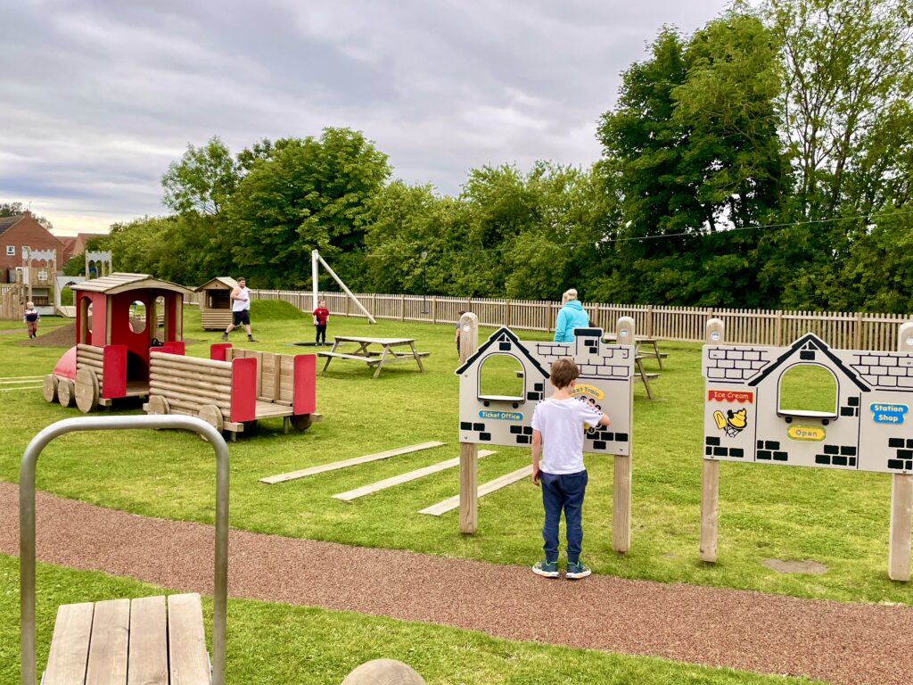 Community Park children’s playground in Pickering, Nort h Yorkshire. Secure fences round the perimeter of the playground.